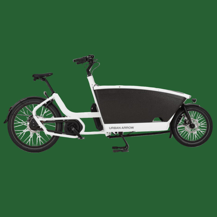 A white Urban Arrow Family Performance Line cargo bike with a large front box and a smaller rear wheel, designed for carrying cargo or passengers.