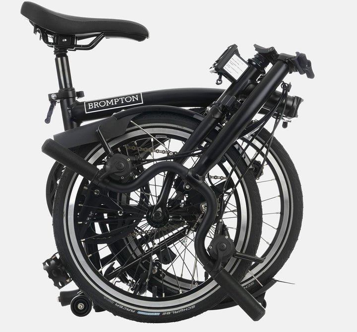 2023 Brompton C Line Explore Mid Handlebar 6 speed folding bike in Matte Black - folded