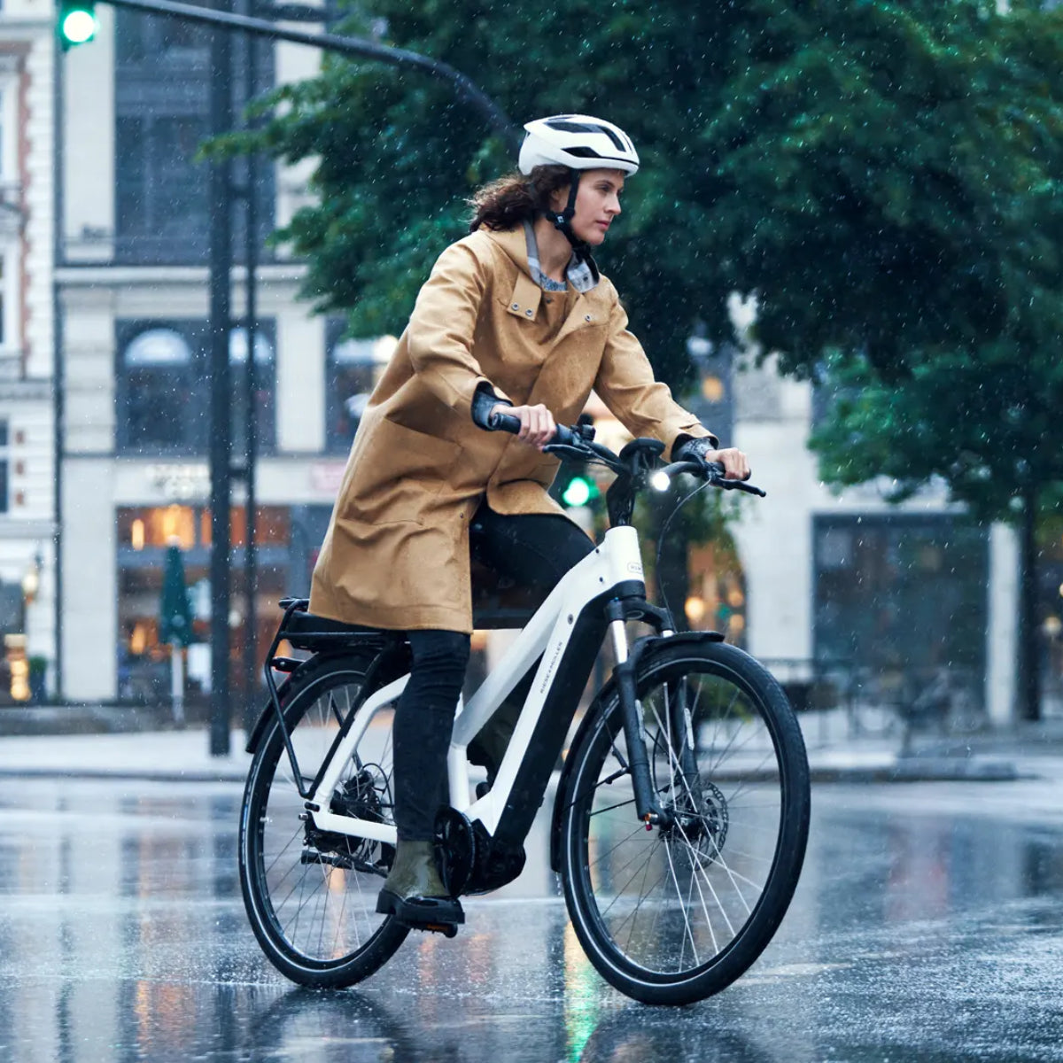 Woman Riding a Riese & Müller Pedal-Assist Electric Bike