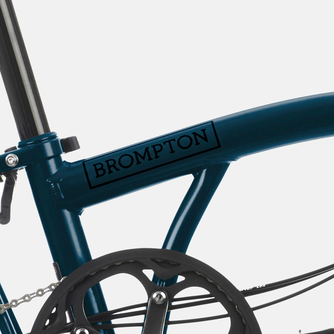 Close Up of Brompton C Line Folding Bike With Rear Rack in Colour Ocean Blue