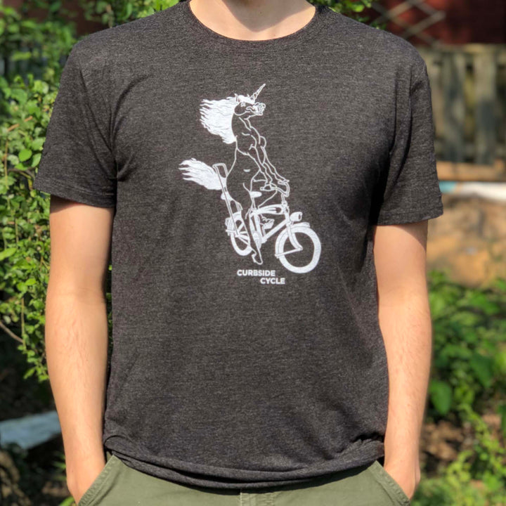 Curbside Cycle Bike Riding Unicorn T-Shirt in Colour Black on Male Model Outside in the Sun