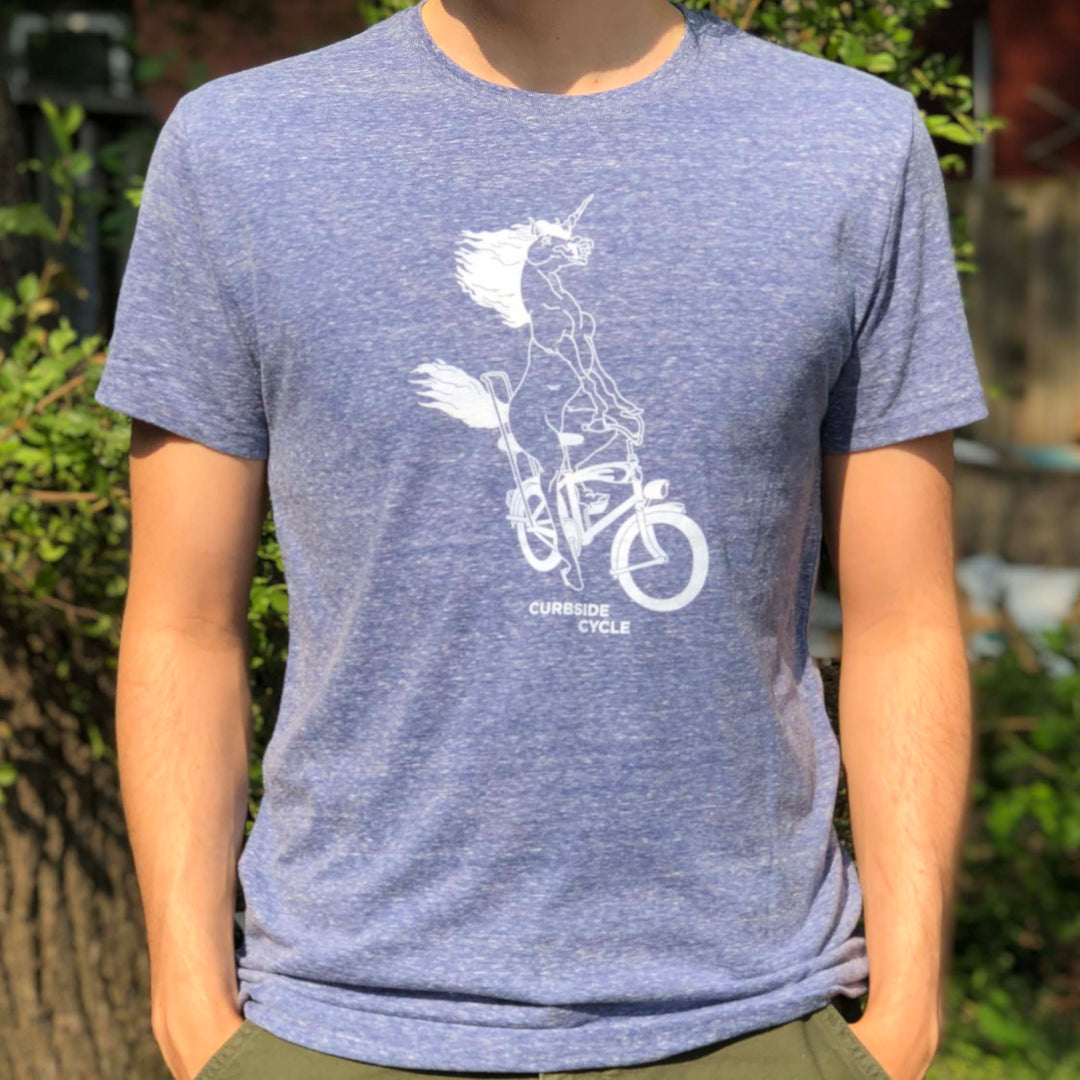 Curbside Cycle Bike Riding Unicorn T-Shirt in Colour Blue on Male Model Outside in the Sun