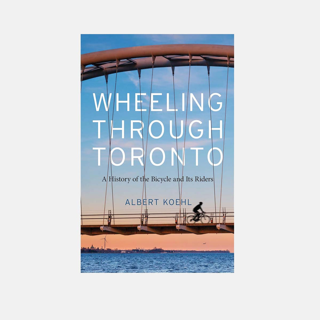 Front of Cover "Wheeling Through Toronto: A History of the Bicycle and Its Riders" By Albert Koehl Showing a Cyclist Crossing a Bridge Over Water