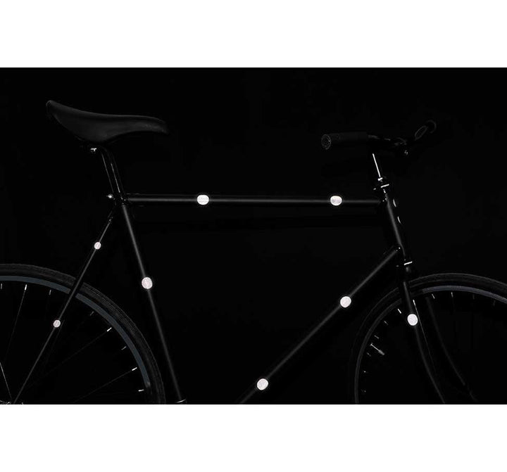 Bike with Bookman Sticky Reflectors in the dark (9064675651)