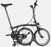 Brompton C Line Urban Mid Handlebar 2-speed folding bike in Black Lacquer - kickstand mode