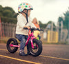 Child riding Frog Tadpole Mini Balance Bike in Pink (605681811507)