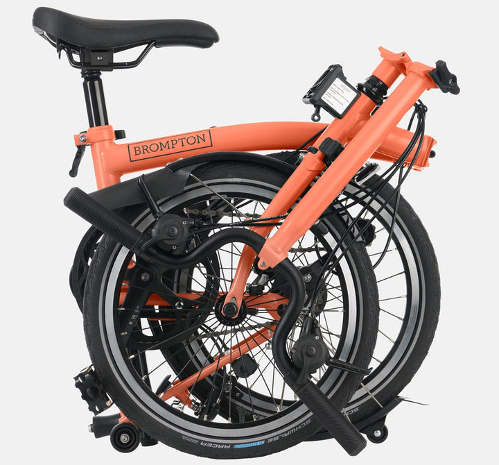2023 Brompton C Line Explore High Handlebar 6-speed folding bike in Fire Coral - folded