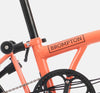 2023 Brompton C Line Explore High Handlebar 6-speed folding bike in Fire Coral - steel frame