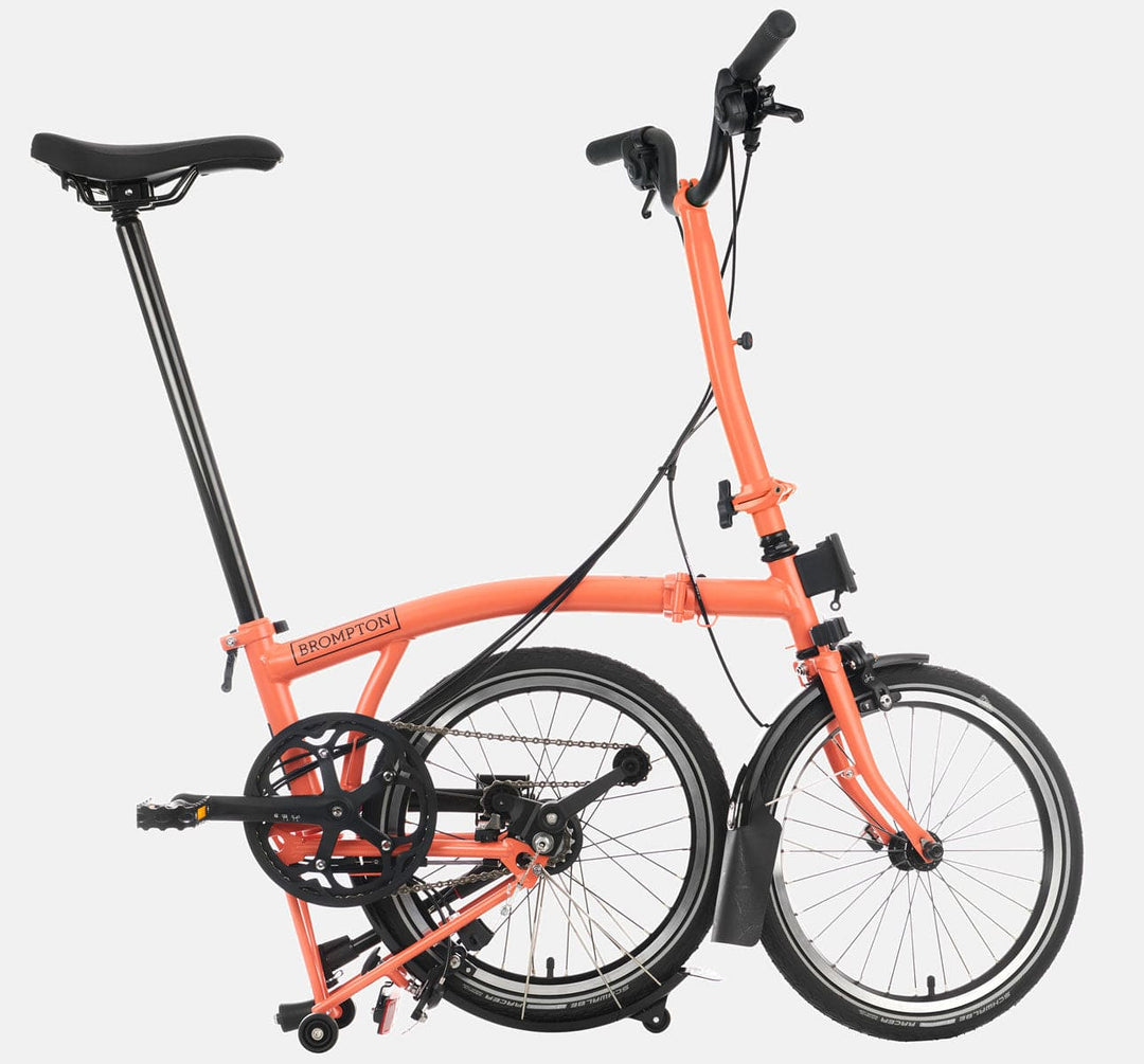 Brompton C Line Urban High Handlebar 2-speed folding bike in Fire Coral - kickstand mode