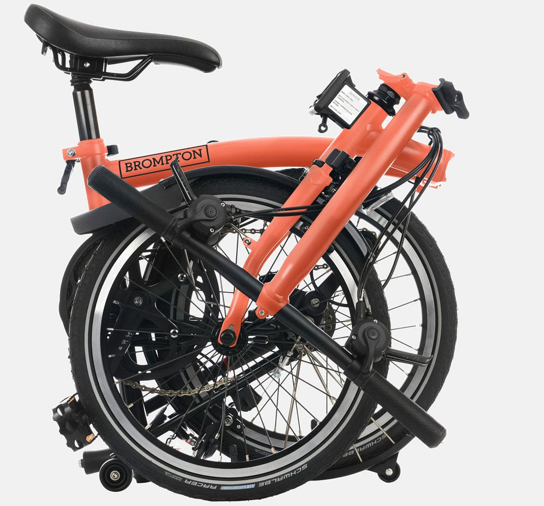 2023 Brompton C Line Explore Low Handlebar 6-speed folding bike in Fire Coral - folded