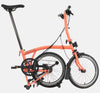 2023 Brompton C Line Urban Low Handlebar 2-speed folding bike in Fire Coral - kickstand mode
