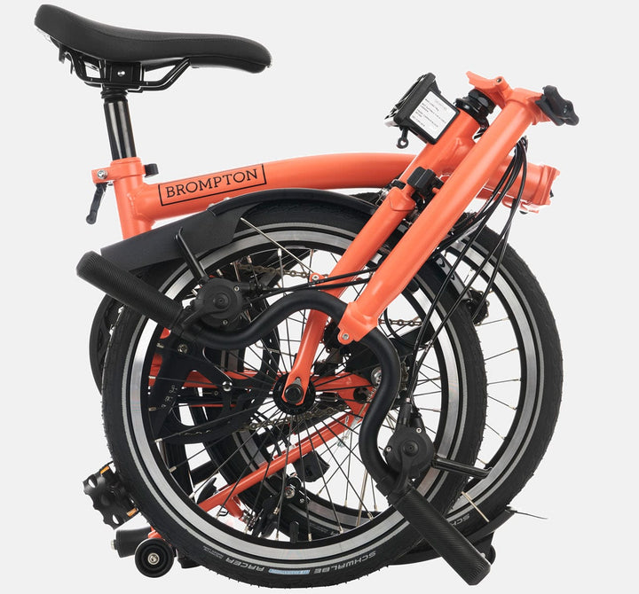 2023 Brompton C Line Explore Mid Handlebar 6 speed folding bike in Fire Coral - folded