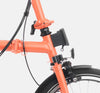 2023 Brompton C Line Explore Mid Handlebar 6-speed folding bike in Fire Coral- Front Carrier Block