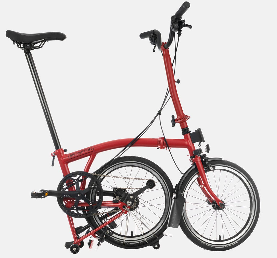 2023 Brompton C Line Explore High Handlebar 6-speed folding bike in House Red - kickstand mode