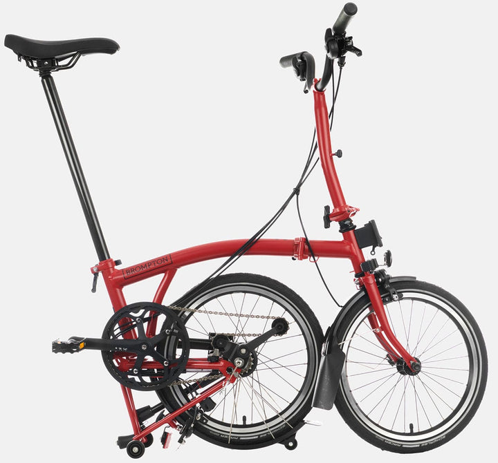 2023 Brompton C Line Urban Mid Handlebar 2-speed folding bike in House Red - kickstand mode