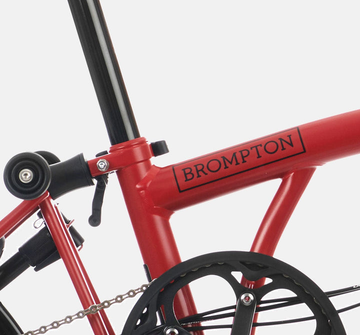 2023 Brompton C Line Explore Mid Handlebar 6-speed folding bike in House Red - steel frame