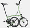 2023 Brompton C Line Urban High Handlebar 2-speed folding bike in Matcha Green - kickstand mode