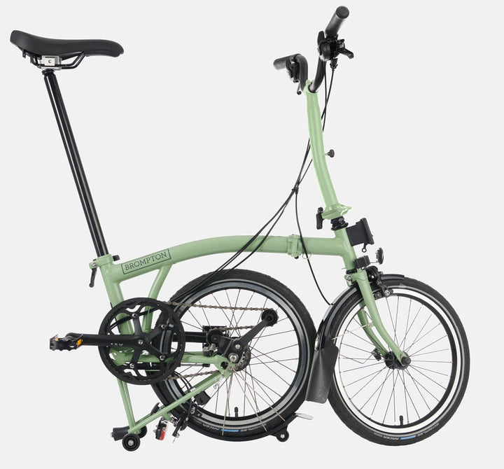2023 Brompton C Line Urban Mid Handlebar 2-speed folding bike in Matcha Green - kickstand mode