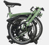 2023 Brompton C Line Explore Mid Handlebar 6-speed folding bike in Matcha Green - folded