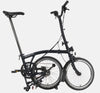 2023 Brompton C Line Urban High Handlebar 2-speed folding bike in Black Matt - kickstand mode