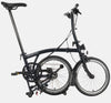 2023 Brompton C Line Explore Low Handlebar 6-speed folding bike in Matt Black - kickstand mode