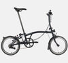 2023 Brompton C Line Explore Low Handlebar 6-speed folding bike in Black Matte - kickstand mode